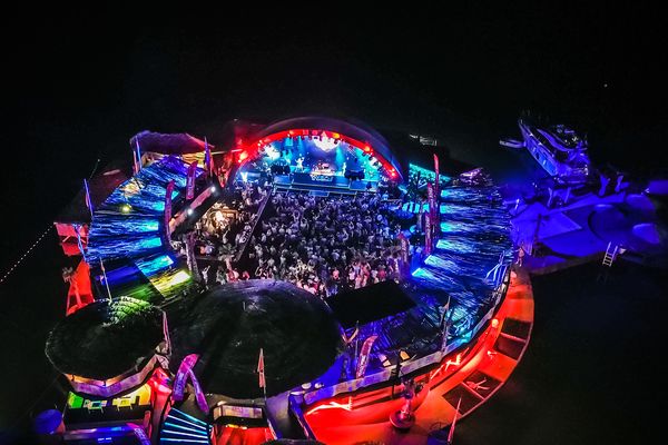 Aerial view of the open-air stage and the crowd at night