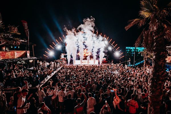 CO2 columns on the stage under palm trees at night