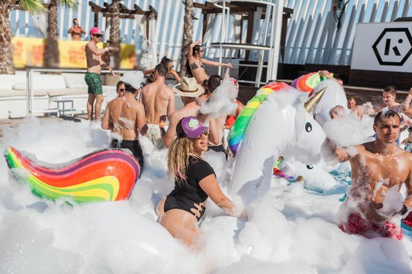 Foam party with a giant unicorn and rainbow inflatables