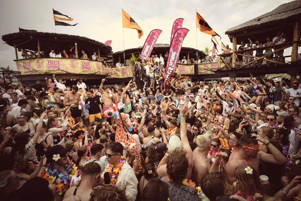 Packed beach club party on a sunny day